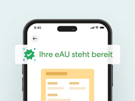 Smartphone zeigt eAU-Benachrichtigung mit Hinweis zur digitalen Krankschreibung.